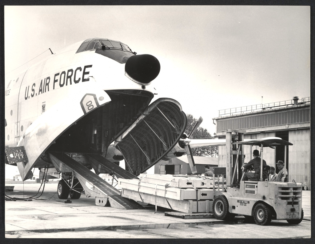 some crates are discharged off a US military plane